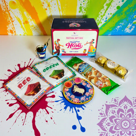 Holi Gift Box with natural gulal, hazelnut chocolates, almonds, cow print plate, pichkari showpiece