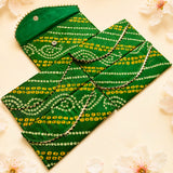 Green brocade fabric money envelope with yellow white geometric bandhani pattern and metallic trim for indian weddings