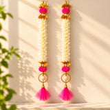 Bangle pom pom hanging backdrop garland in bright pink and gold with jasmine flowers for Indian festive decorations