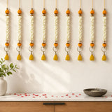 Seven bangle pom pom hanging garlands with white jasmine flowers orange marigold pom poms brass rings and yellow tassels for festive decor