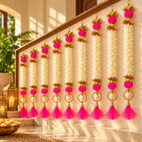 Bangle pom pom hanging backdrop garland with vibrant pink white floral and gold accents for festive indian decor