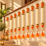 Ornate orange and white bangle pom pom hanging garland with gold accents for indian festive decorations and weddings