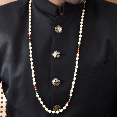 Handmade Barati Swagat Mala pearl necklace with red green accents on black shirt