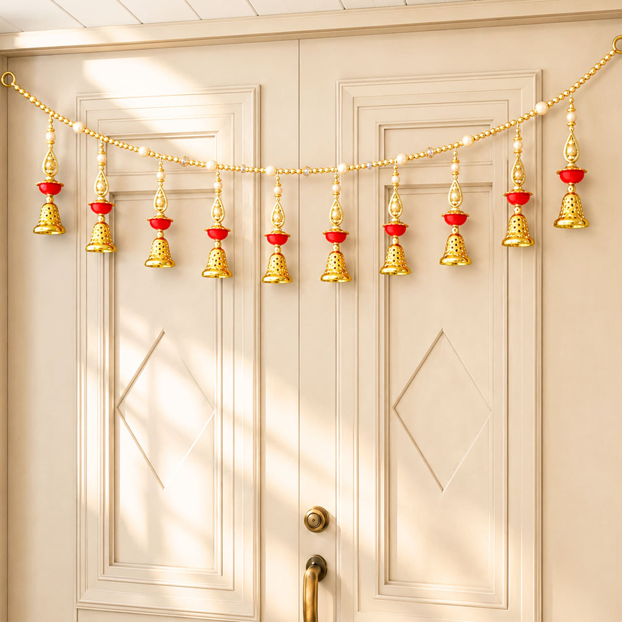 Bead door toran with gold and red decorative bell garland and pompom for traditional indian festive home decor