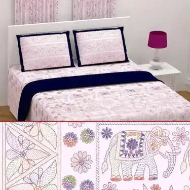 Bed with pink and navy blue bedding featuring a floral pattern.