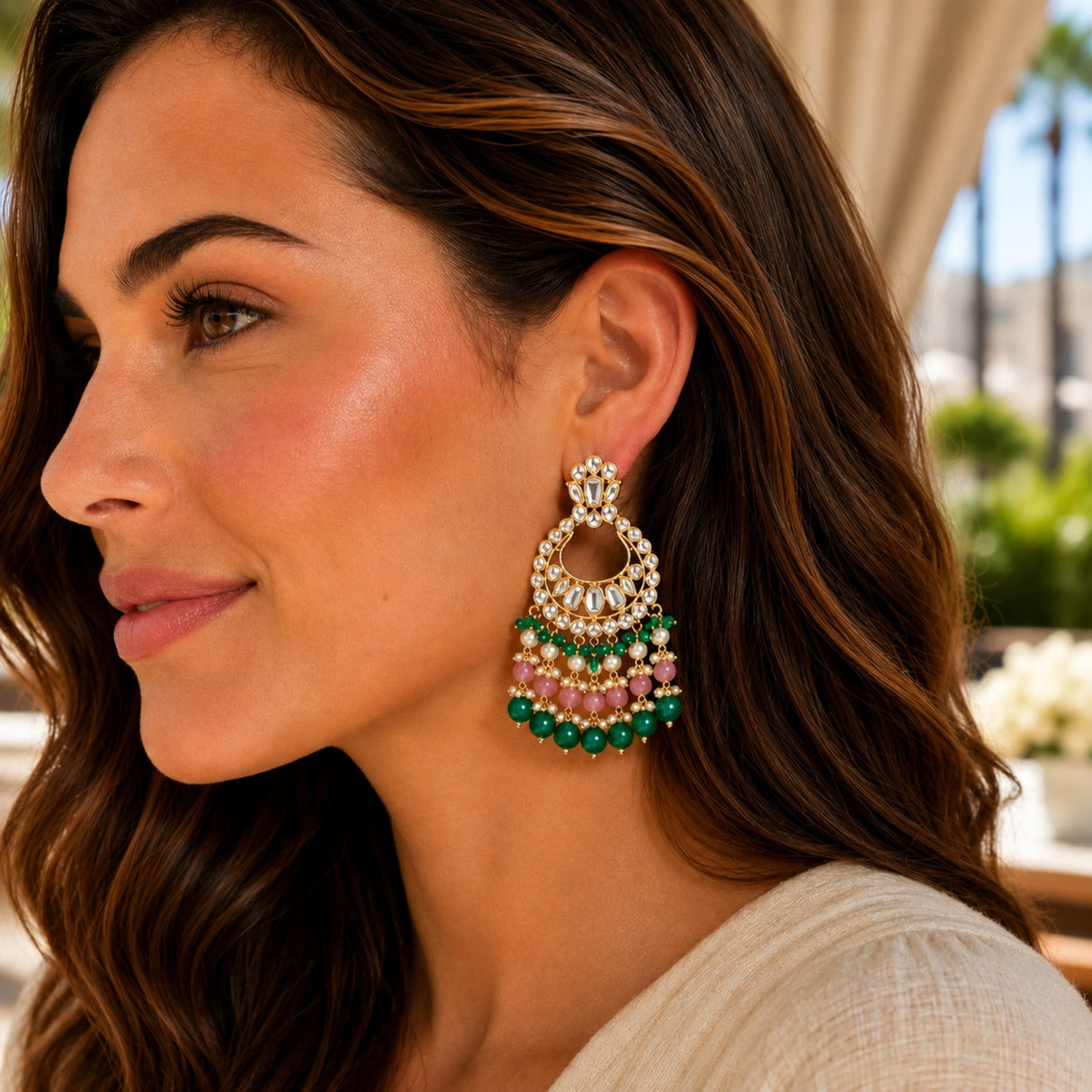 Oversized gold tone kundan chandelier earrings with faux pearls and multicolored beads for diwali and weddings