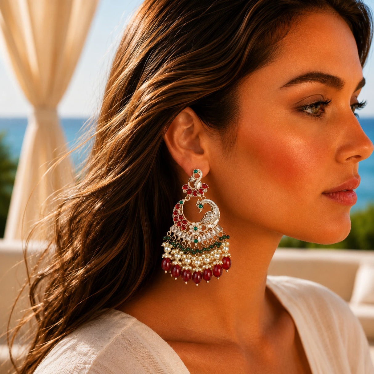 Oversized Indian peacock kundan earrings with red and green gemstones in silver tone for Diwali and ethnic wear