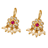 Indian floral kundan gold tone earrings with central ruby, clear stones, and dangling faux pearls for ethnic wear