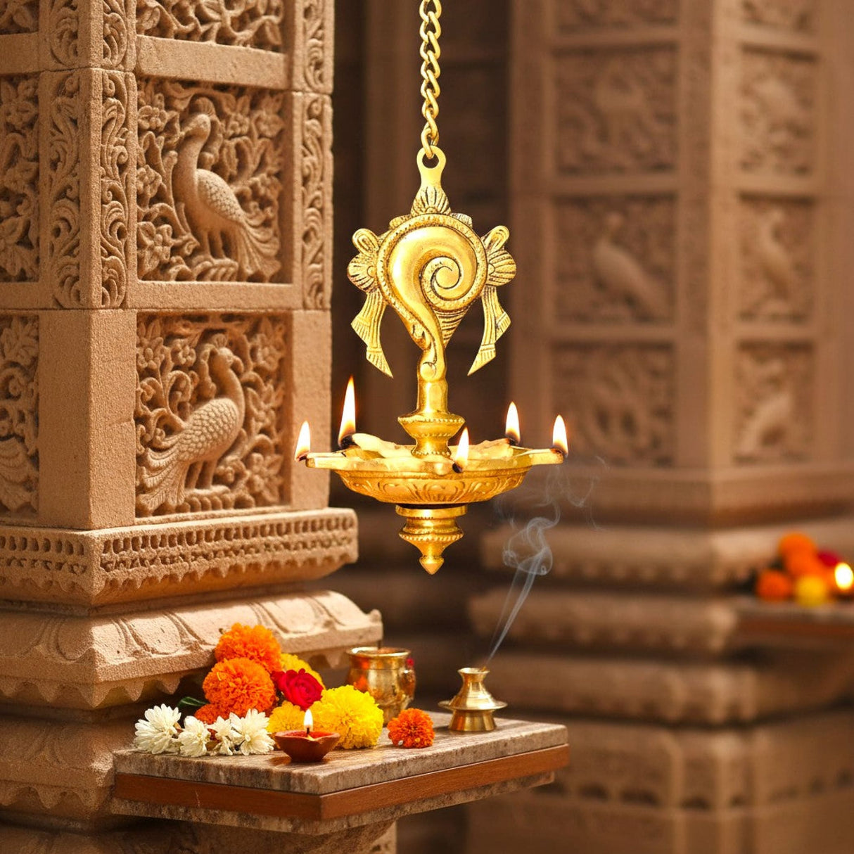 Golden brass Annam Shankh wall hanging oil lamp with peacock motifs, 5 lit wicks