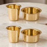 Set of two brass-colored cylindrical metal cups with flared rims for South Indian filter coffee and tea serving