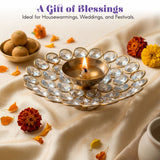 A golden brass decorative diya adorned with clear faceted crystal stones for Diwali puja and home temple decor