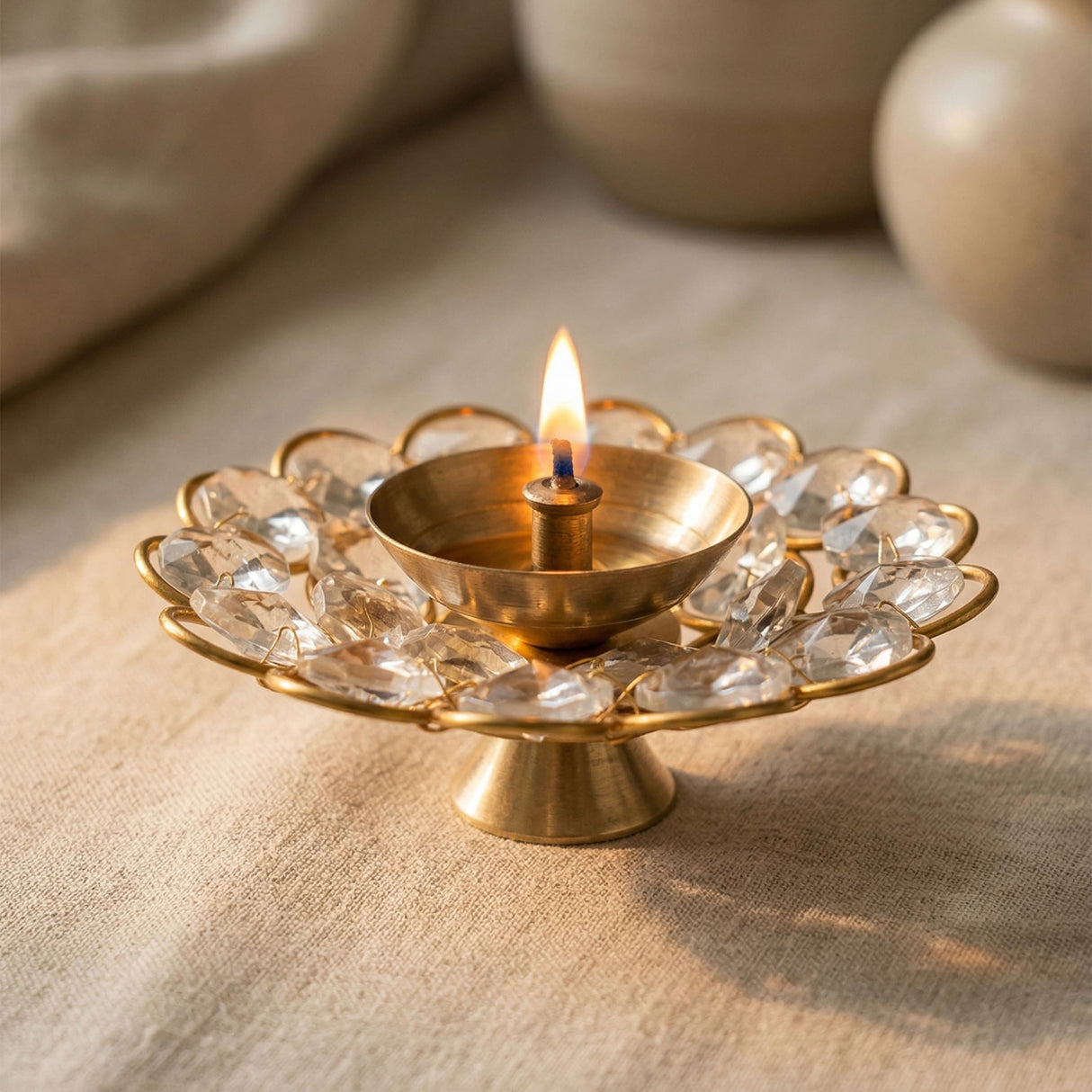 Brass decorative diya with golden finish and clear acrylic glass floral design for Diwali puja and home temple decor