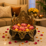 Golden ornate brass diwali oil lamp holder with elephant motifs and floral decorations for pooja room decor