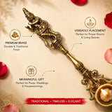 Golden brass dancing ganesha krishna spoon with intricate detailing and ornate handle for traditional home temple decor