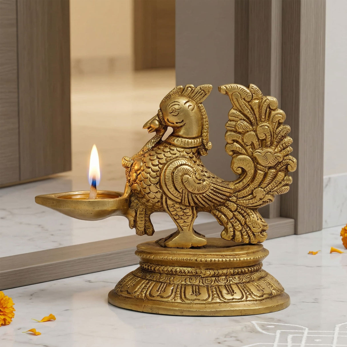 Golden brass peacock diya oil lamp with intricate feather detailing and decorative base for home temple and diwali decoration