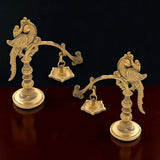 Golden brass bird-themed oil lamp diya with intricate carvings and ornate base for traditional home and temple use