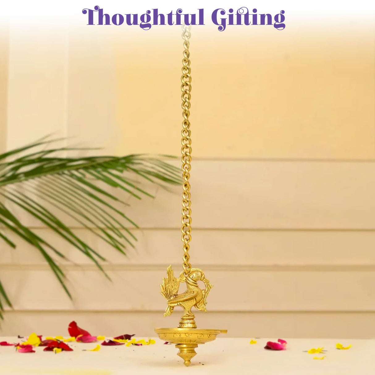 Golden brass hanging oil lamp diya with intricate peacock bird design and chain suspension for home temple diwali decor