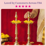Two ct brass oil lamp diya samai deepak lamp with golden metallic finish and yellow marigold flowers for diwali decoration