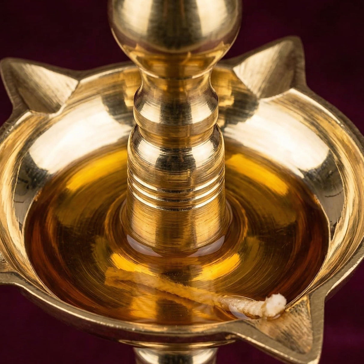 Golden brass oil lamp diya with star-shaped base and central wick holder for home temple mandir and diwali decoration