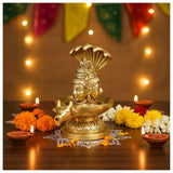 Golden brass deity head oil lamp with floral motifs for Shiva Lingam Pooja Decor