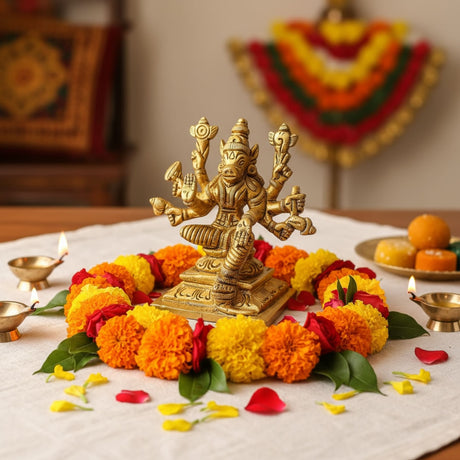 Golden Lakshmi goddess statue with multiple arms in traditional attire for Pooja room