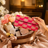 Vibrant pink brocade fabric money envelope with intricate gold paisley embroidery for Indian wedding cash gift
