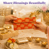 Orange brocade fabric money envelope with gold circular paisley patterns for indian wedding and cash gift use