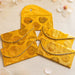 Brocade fabric money envelopes in bright yellow with gold floral embroidery and silver beaded edges for Indian weddings