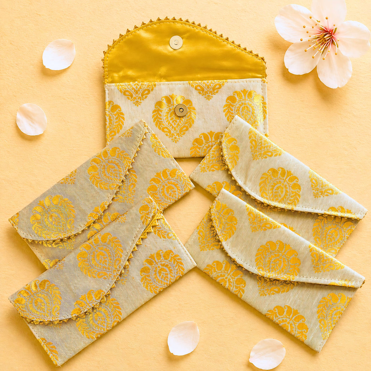 Yellow and cream brocade fabric money envelopes with gold button closures decorative floral shagun lifafa for cash gifts