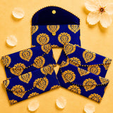 Brocade fabric money envelope in deep blue velvet with intricate gold paisley embroidery and button closure for gifting