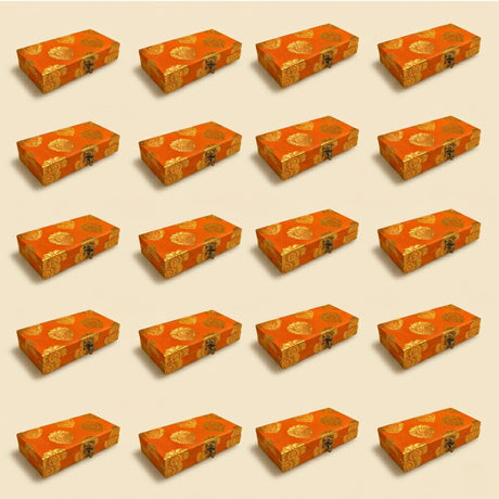 Orange brocade gift boxes with gold floral patterns and metal clasps for indian muslim pakistani wedding favors