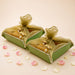 Green rectangular brocade jewelry organizer boxes with gold organza ties and pearl embellishments for shagun gifts