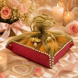 A luxurious maroon brocade 2ct gift basket indian mithai box with olive green organza bow and gold leaf accents
