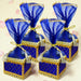 Blue and gold brocade potli gift boxes with sheer organza tops and tassels for traditional indian wedding favors