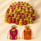 Traditional indian brocade print silk potli bags in vibrant pink and orange with gold paisley for festive occasions