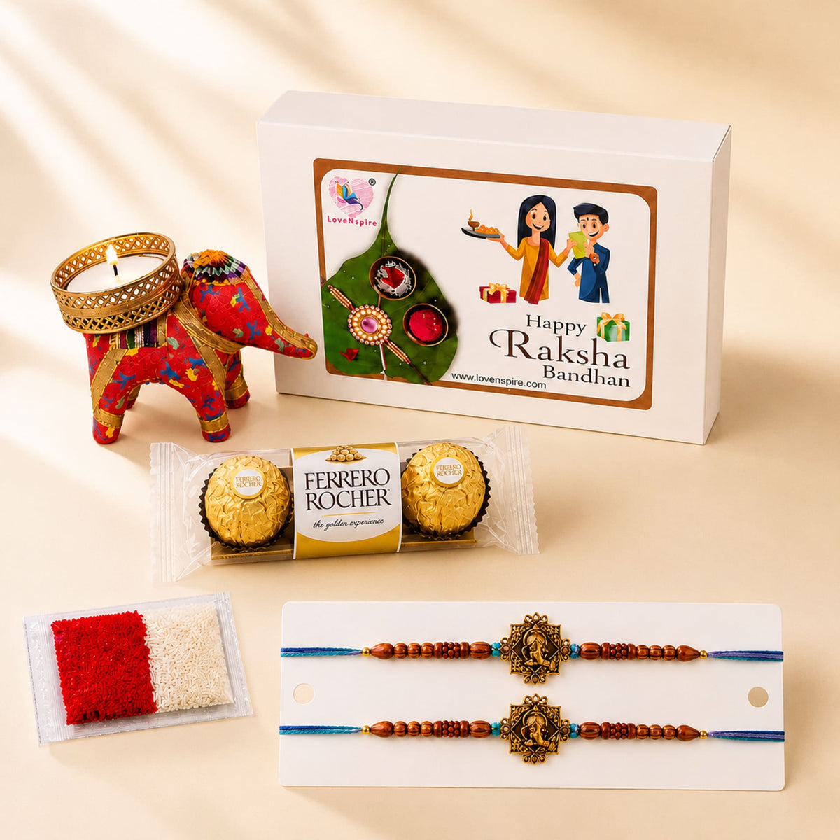 Red and gold embroidered elephant-shaped candle holder from designer rakhi gift hamper for brother and bhabhi