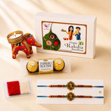 Red and gold embroidered elephant-shaped candle holder from designer rakhi gift hamper for brother and bhabhi