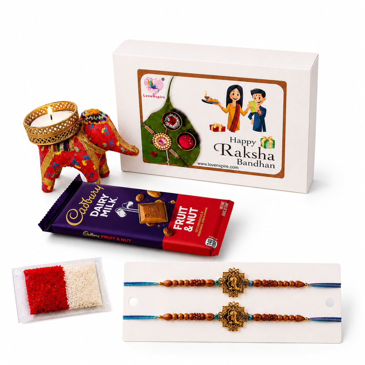 Red and gold embroidered elephant-shaped candle holder in a designer rakhi gift hamper for brother and bhabhi