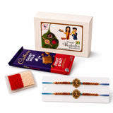 Golden ornate designer rakhi with blue and brown beaded cords in handmade raksha bandhan gift hamper for brother and bhabhi