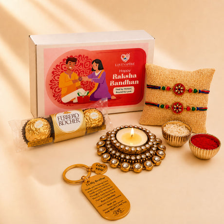 Gold-colored designer rakhi gift hamper keychain with engraved message and love you charm for brother and bhabhi