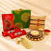 Gold-colored keychain with engraved message and heart-shaped charm in designer rakhi gift hamper for brother and bhabhi