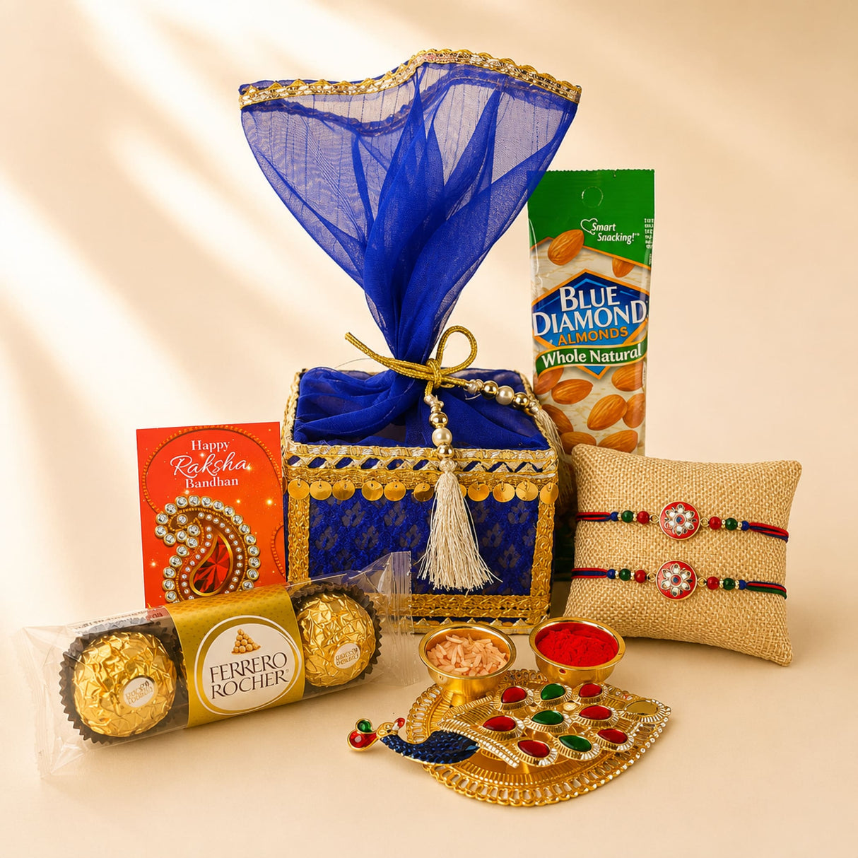 Blue and gold ornate designer rakhi gift box with sheer blue organza cover and golden ribbon for brother and bhabhi
