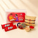 Gold-colored peacock-shaped decorative tray with red and green enamel and rhinestones in designer rakhi gift hamper set