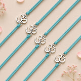 Turquoise braided cord bracelets with silver toned om charms for bhaiya and bhabhi traditional raksha bandhan gift