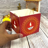Red paper lantern with gold mandala and diya cutout design for Diwali decoration