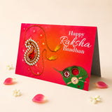 A vibrant red bulk rakhi greeting card set featuring gold diamond-encrusted rakhi design with green leaf motifs