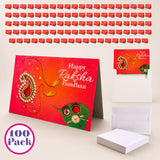 Red happy raksha bandhan greeting card with ornate gold paisley and gemstone leaf design in bulk sibling gift set