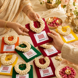 Aishwarya brand white jasmine flower garland on red card in Varalakshmi Vratham gift hamper for pooja and festive occasions