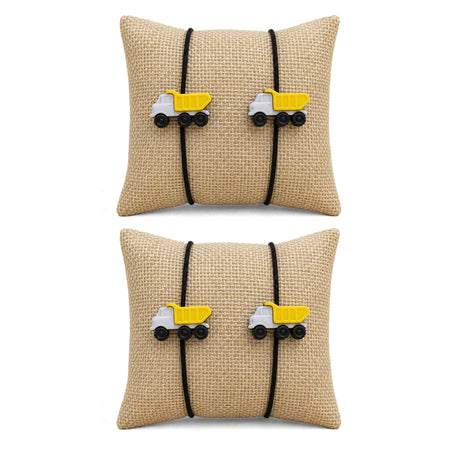 Beige woven fabric square pillow with black elastic bands and yellow dump truck charms for cartoon rakhi gift set