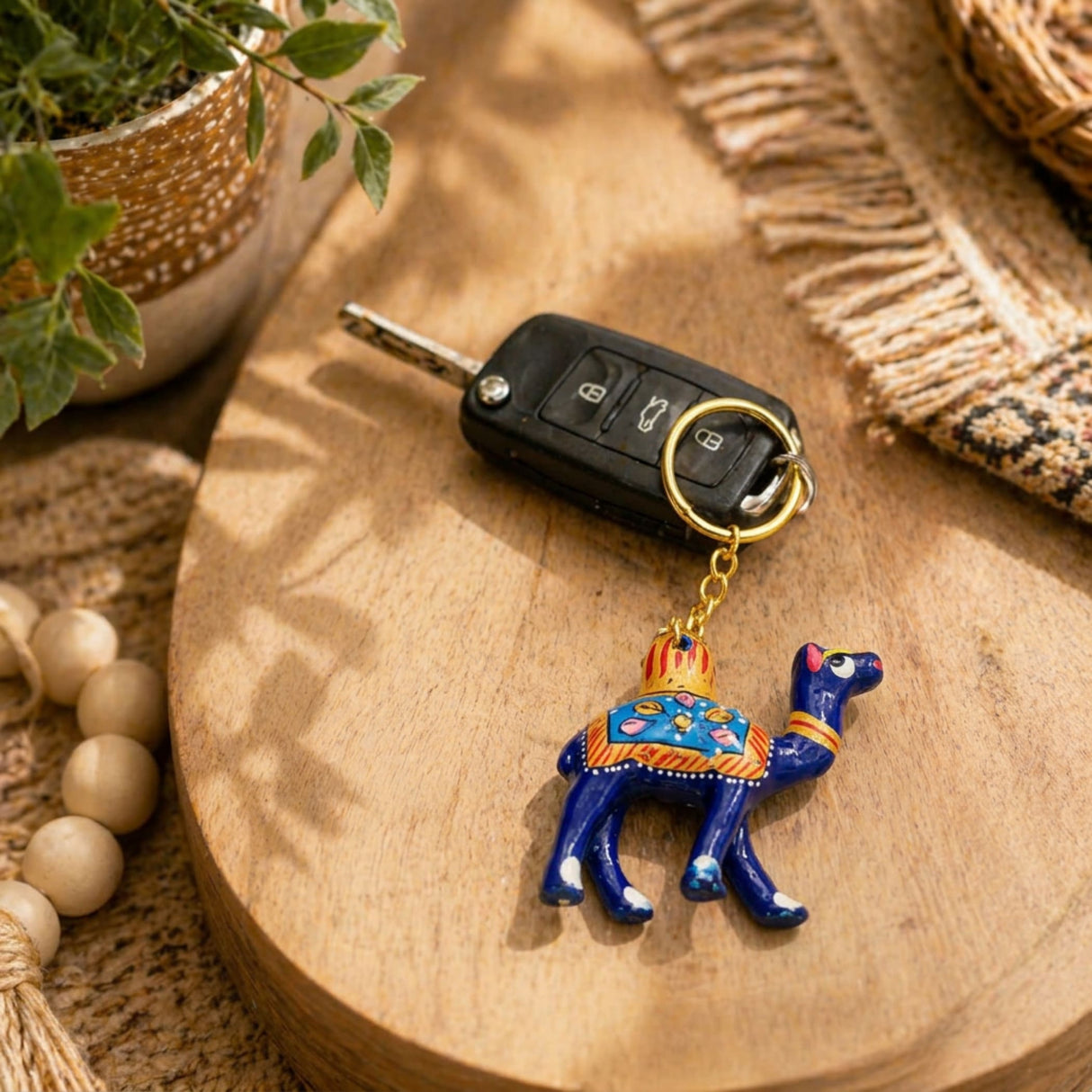 Handmade ceramic blue camel keychain with orange gold detailing and crown ornament indian good luck charm for bags